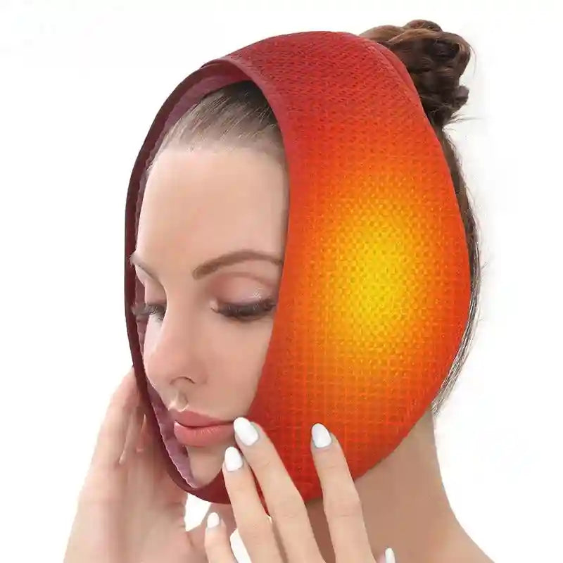 A woman wearing an orange and red gradient heated wrap around her chin and jaw for pain relief.