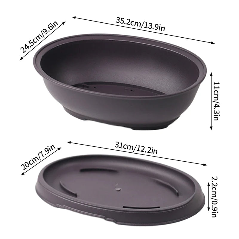 Dark gray round plastic plant pot with open basin and drainage holes