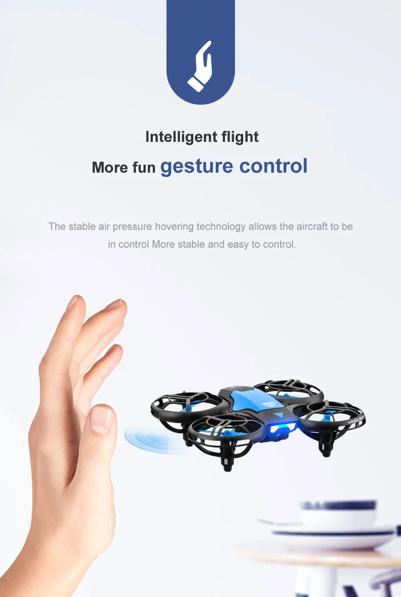 Small blue and black mini drone with propeller guards, controlled by hand gestures.