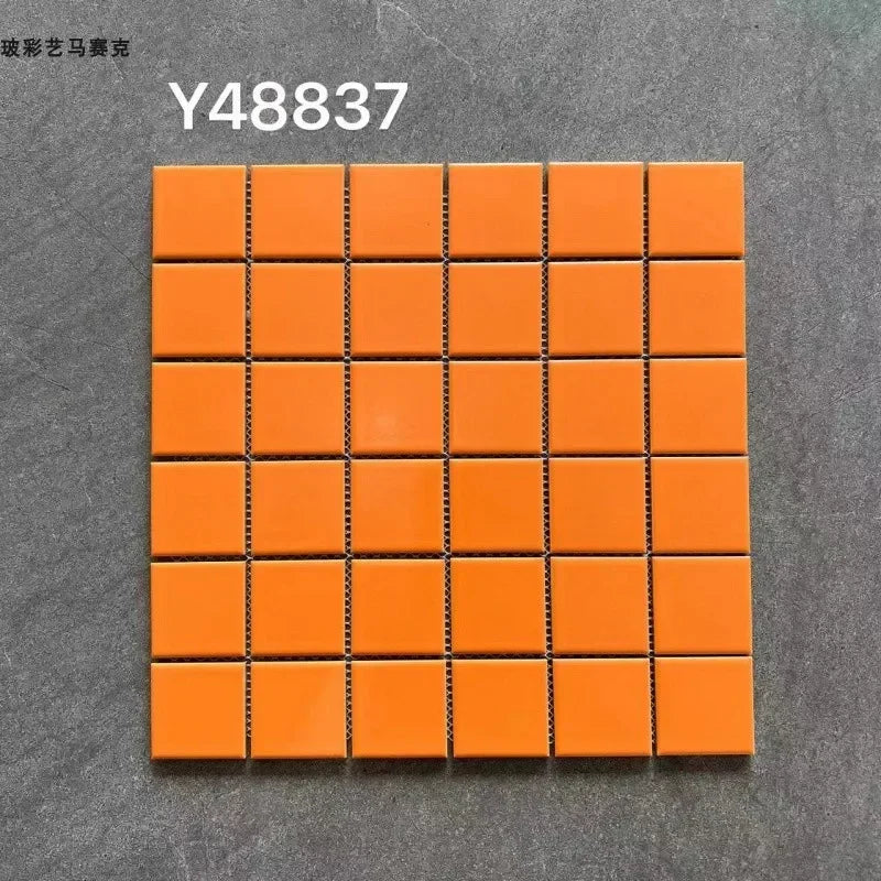 Ceramic mosaic tile sheet with small square orange-red tiles on grid backing
