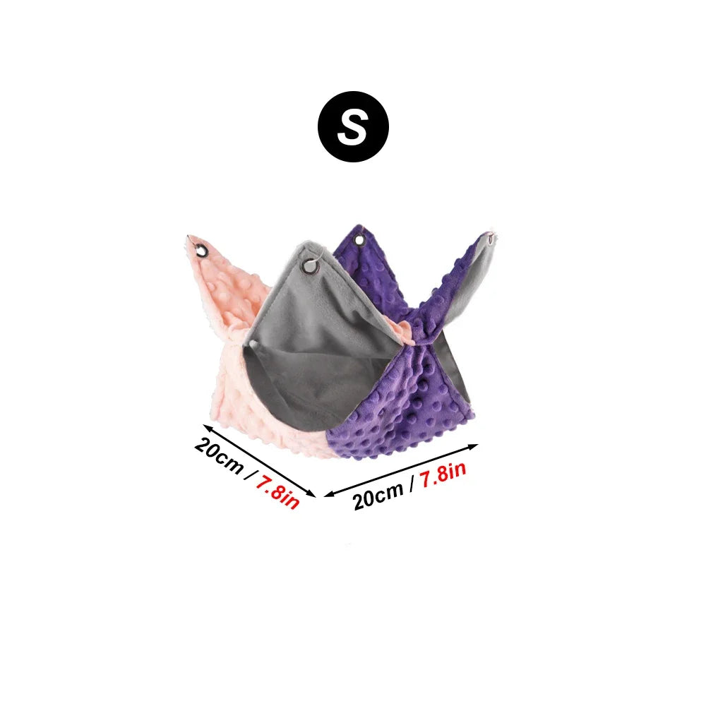 Small cozy pink and purple pet hammock for guinea pigs, fleece hanging bed for winter warmth in cage accessories.