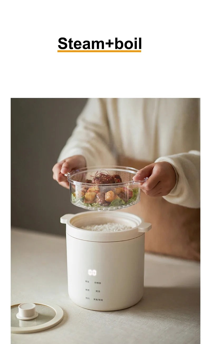White electric rice cooker with steam and boil feature, food transfer shown