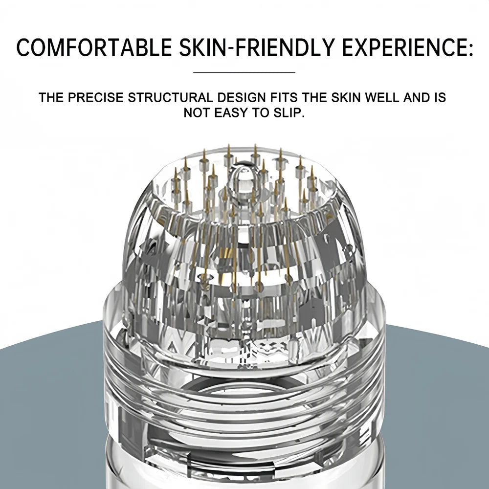 Clear, rounded applicator head with thin, gold-toned micro-needles inside a transparent plastic casing.