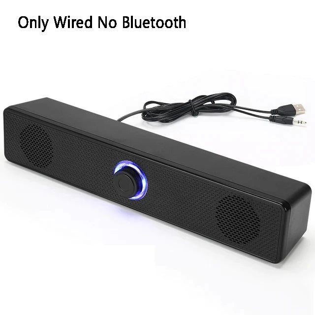 Black soundbar speaker with blue ring button and wired USB cable, no Bluetooth