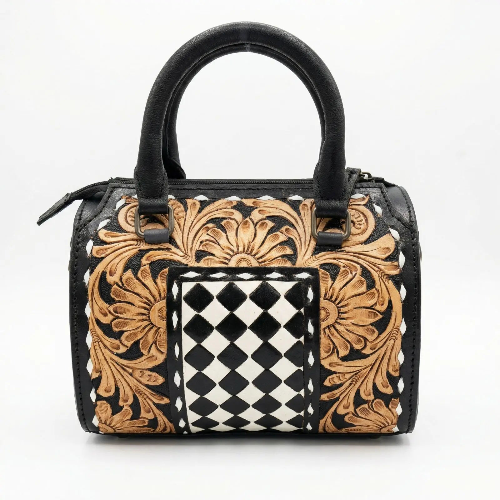 Luxury genuine leather duffle trunk with black and tan floral tooling and a center black-and-white checkerboard panel.