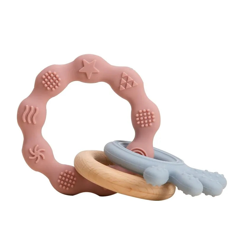 Pink and blue silicone and natural wood baby teething ring set for soothing relief.