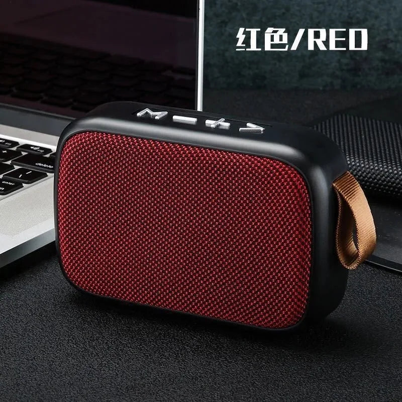 Tidesmit rectangular portable Bluetooth speaker with a red fabric grille, black casing, and tan side carry strap.