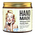 Amber jar of "Hand Made Whipped Tallow Honey Balm" with a gold lid and a vintage illustration of a blonde woman.
