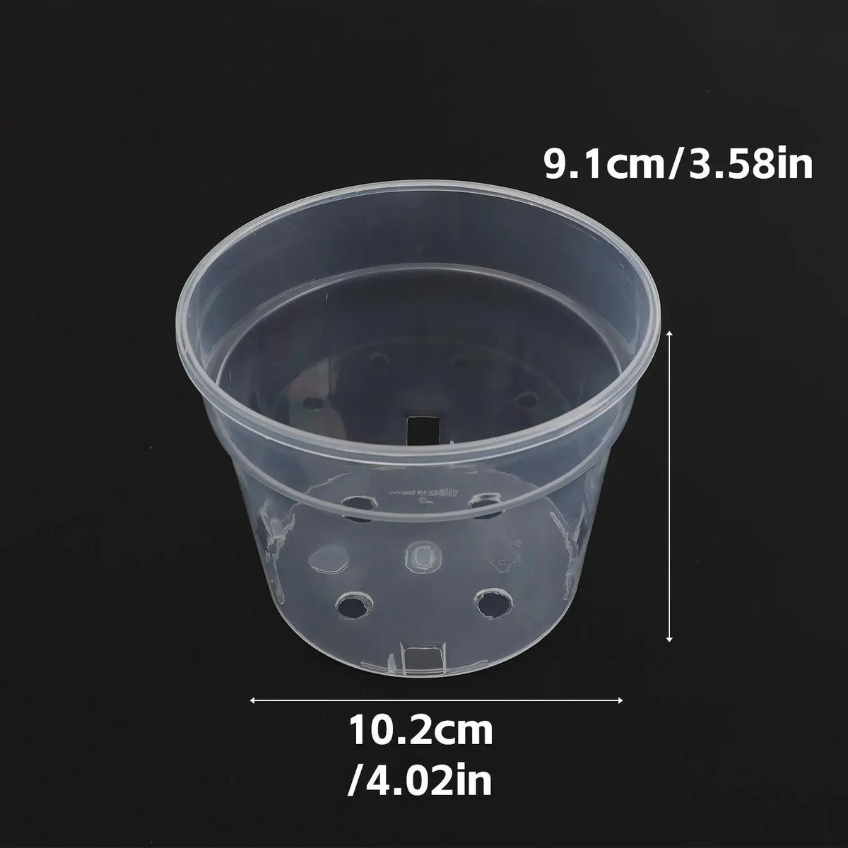 Clear plastic nursery pot with drainage holes, 10.2cm wide, transparent cup