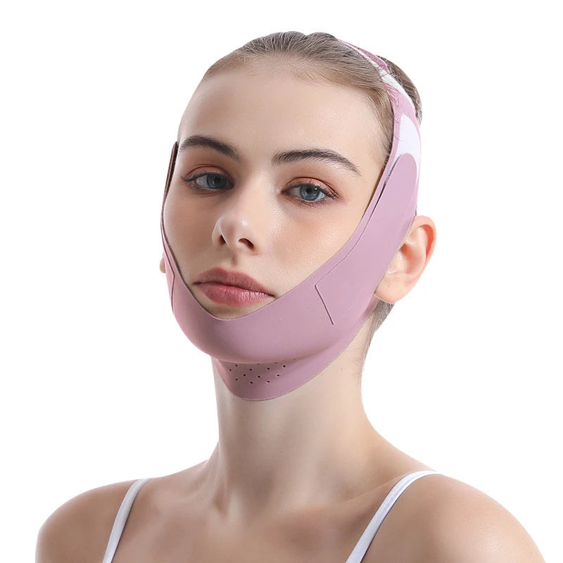 A woman wearing a mauve, V-line facial slimming strap that wraps under the chin and secures over the head.