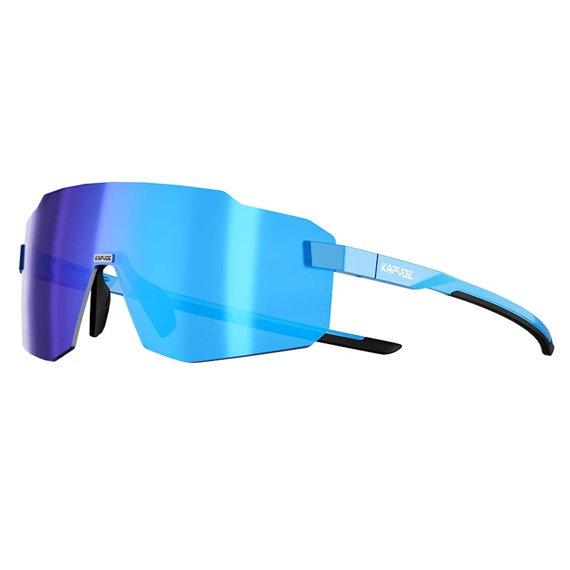 Photochromic cycling sunglasses with vivid blue gradient shield lenses and dark blue frame