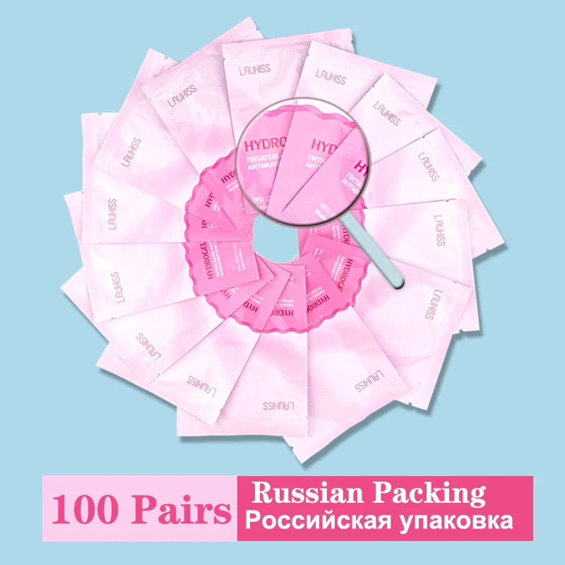 Pink hydrogel under-eye patches in individual sachets. Lint-free lash extension pads for professional beauty salons.