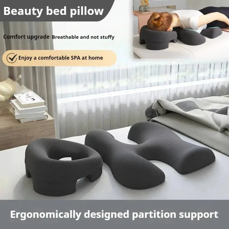 Dark gray ergonomic foam massage cushions: one face pillow and one H-shaped chest support pillow for prone sleeping.