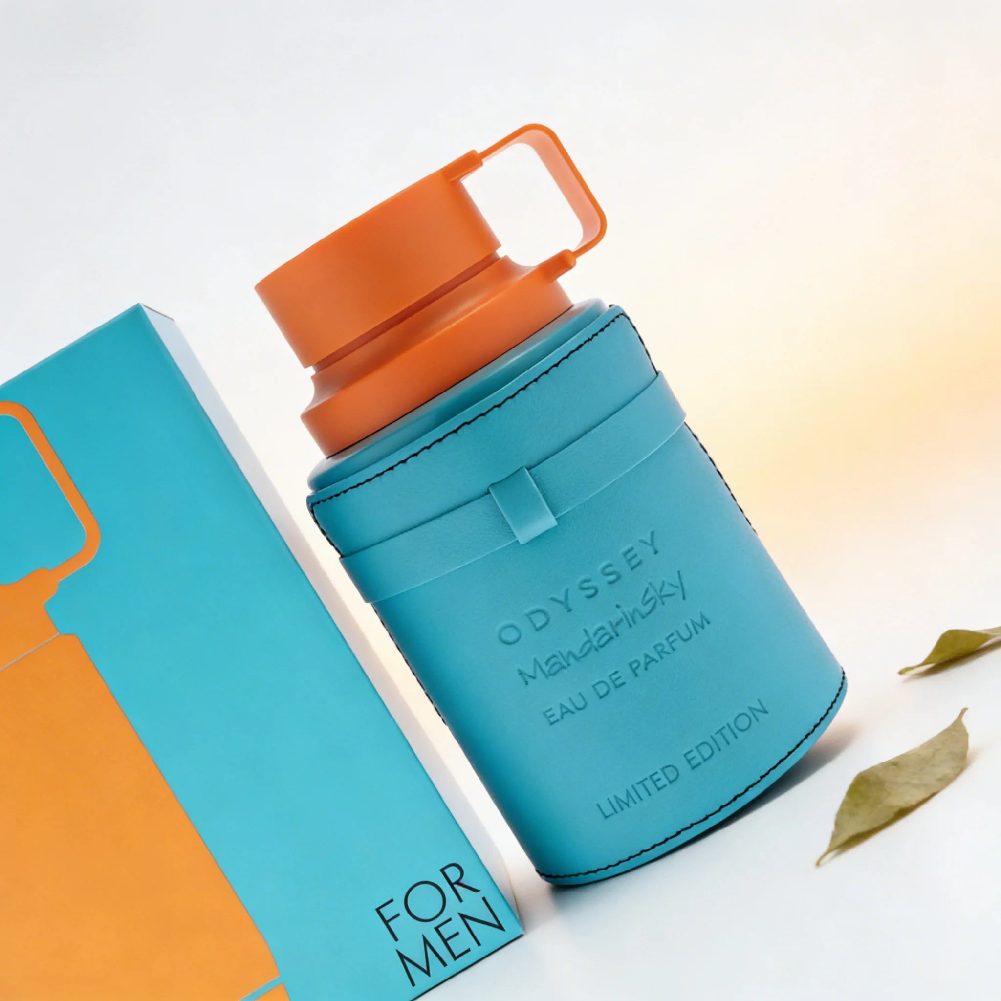 Armaf Odyssey Mandarin Sky EDP for men: orange-capped blue bottle, woody mandarin fragrance, limited edition cologne.