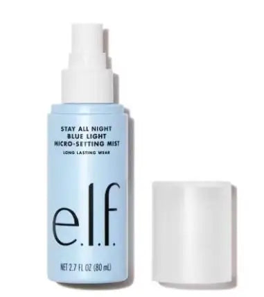 e.l.f. Stay All Night Blue Light Micro-Setting Mist in a light blue spray bottle with white cap.