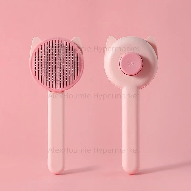 Pink self-cleaning cat grooming brush with stainless steel bristles for effective pet hair removal and detangling.