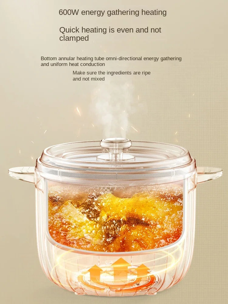 Clear inner pot with lid containing steaming food on an electric rice cooker