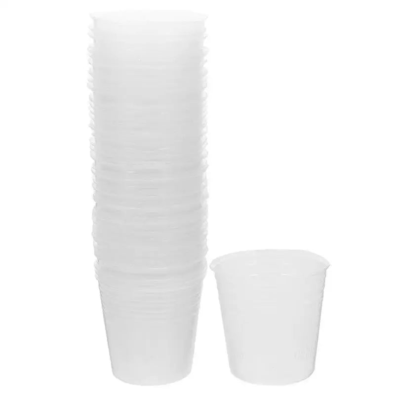 Stacked clear plastic nursery pots with drainage holes, tall cup and small starter cup