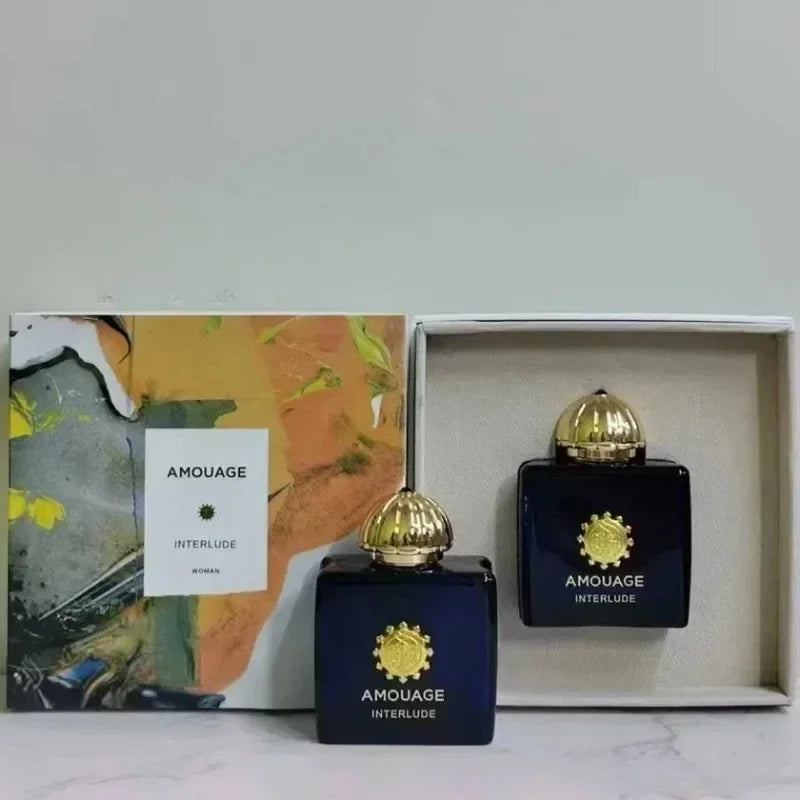 Amouage Interlude Eau de Parfum: Luxury woody oriental unisex scent in iconic blue glass bottles with gold caps.