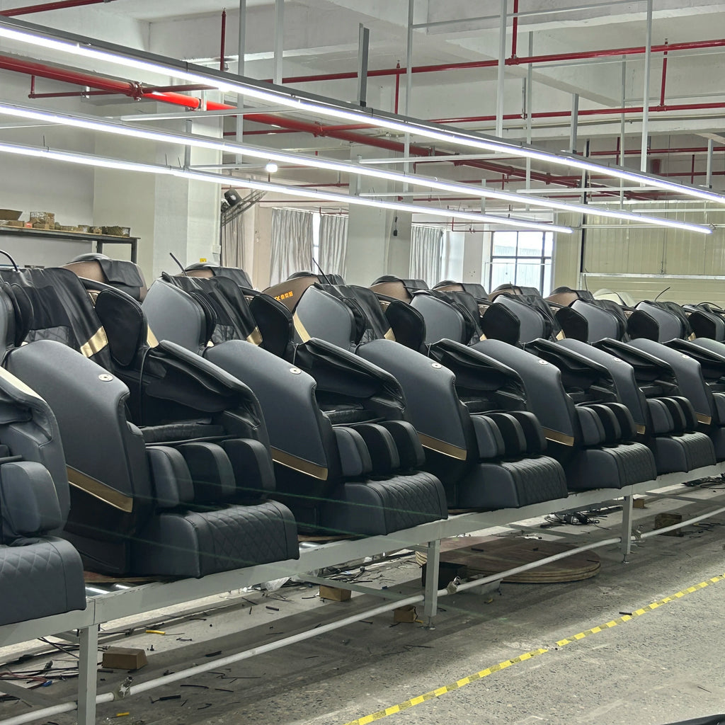 Gray shiatsu massage chairs with cushioned back and arm pads, side view row
