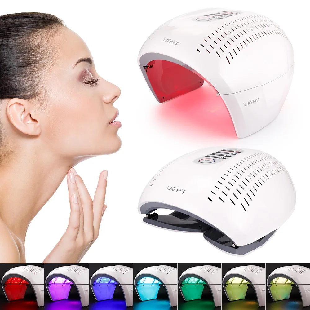 White dome-shaped LED facial light therapy device for skin rejuvenation, showing various color settings.