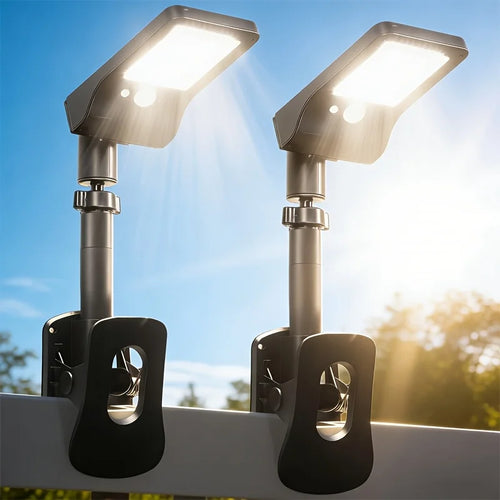 Solar clip-on LED lights, 2-pack, black dusk-ready fixtures with adjustable lamp heads