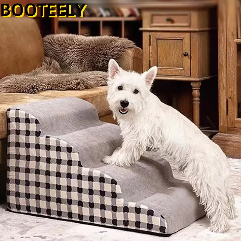 Dog using grey memory foam pet stairs for sofa. Anti-slip, washable, stable dog ladder for easy furniture access.
