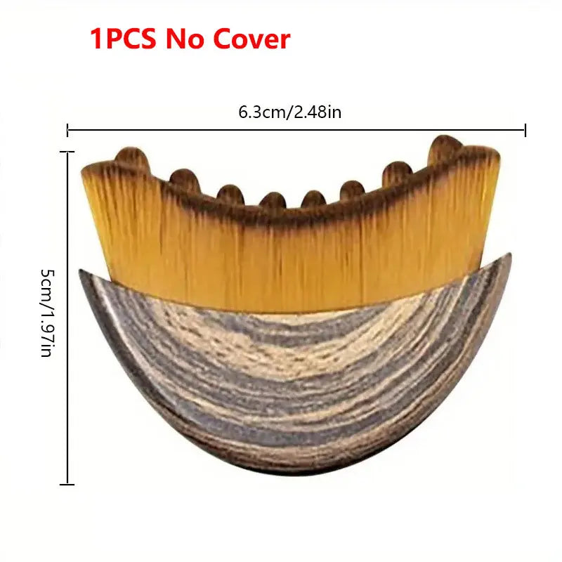 Crescent-shaped lymphatic contour face brush with wood-grain base and soft golden bristles, measuring 6.3cm by 5cm.
