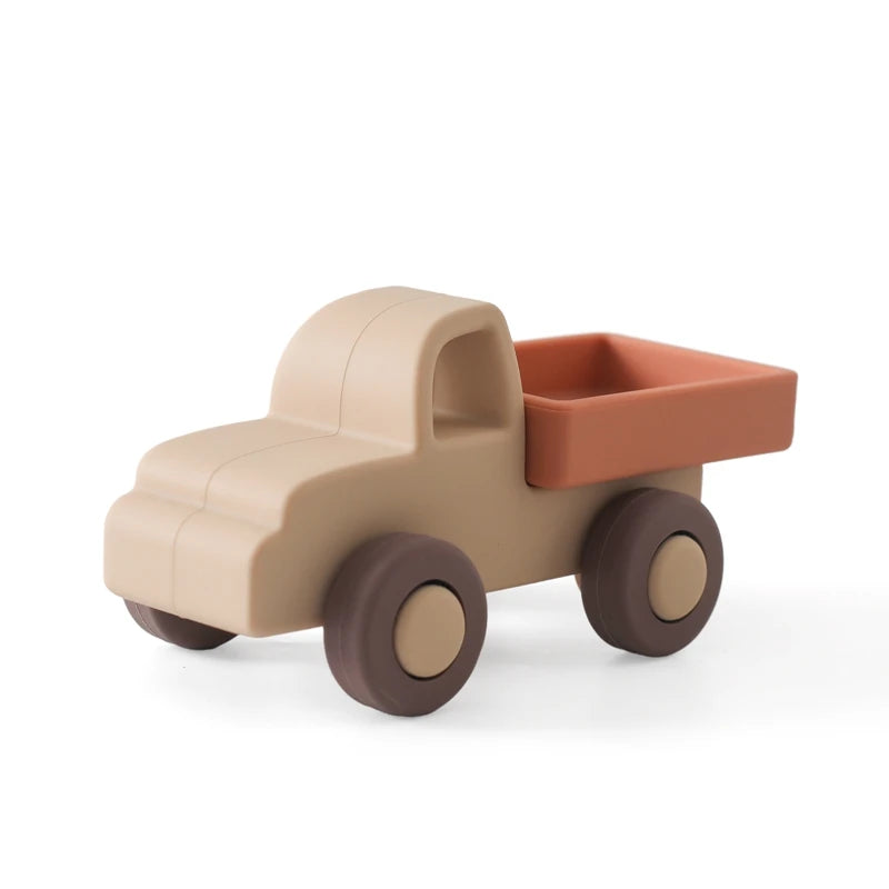 Tan and brown silicone truck baby teething toy for soothing gums.