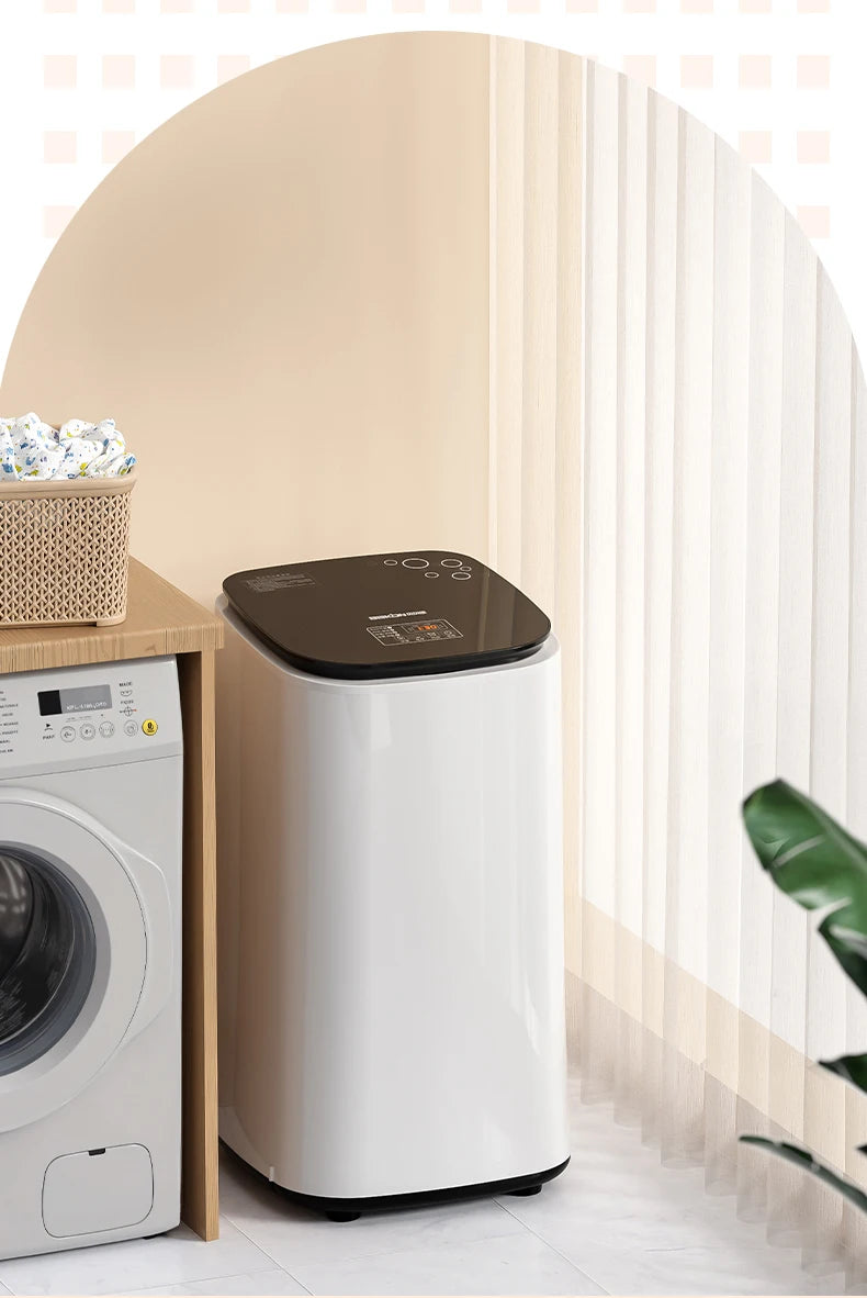 Tidesmit 60L automatic dryer with baby clothes disinfection and air-drying features shown in a compact wardrobe unit.