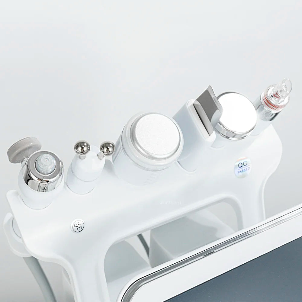 7-in-1 professional hydro facial machine with silver ultrasonic, RF, and oxygen skin lifting beauty device heads.