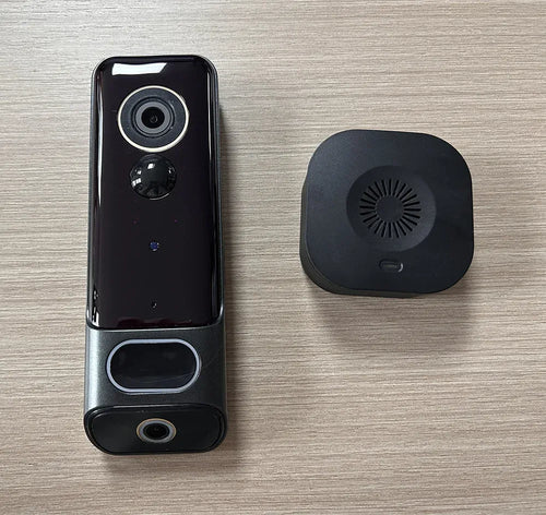 Black dual-lens video doorbell camera with top lens and circular night sensor