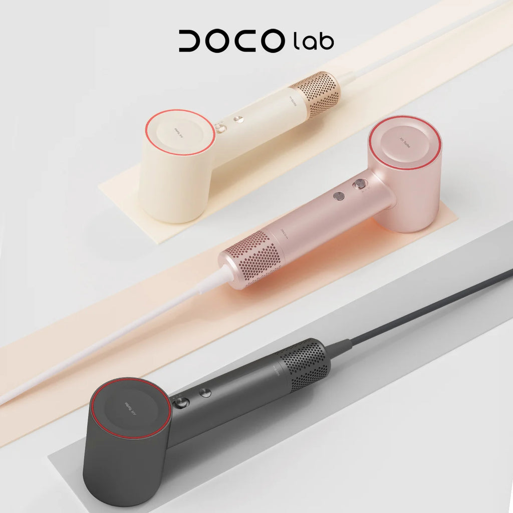 DOCO high-speed negative ion hair dryers in white, pink, and grey with sleek, lightweight, modern cylindrical design.