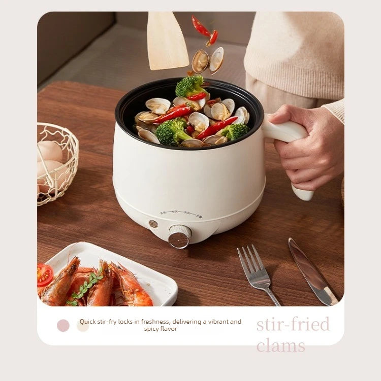 White electric hot pot with black inner liner, clams and vegetables being cooked