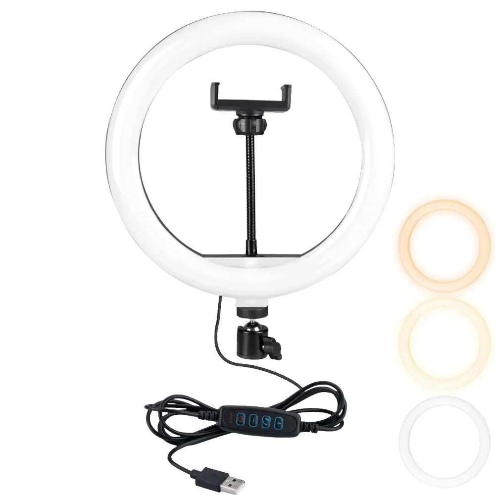 White circular LED ring light with a central phone mount, USB power cable, controller, and three color temperature