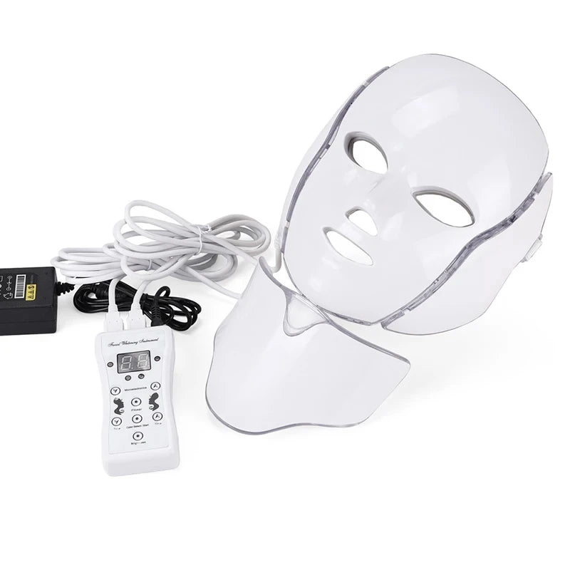 White LED facial and neck treatment mask with a digital handheld controller and power adapter for skin therapy.