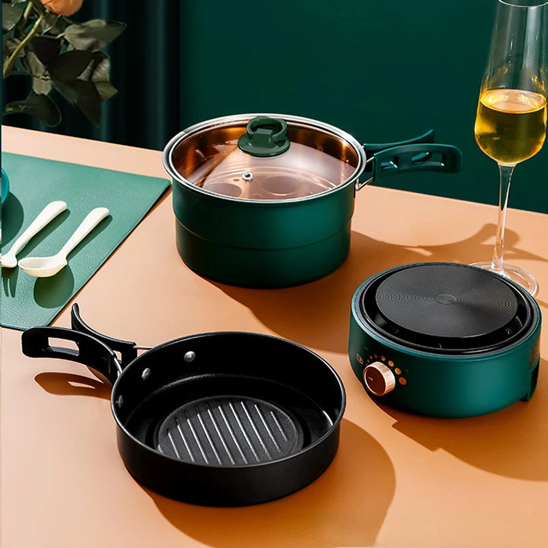 Portable electric multi cooker set with teal pot lid and black split fry pan