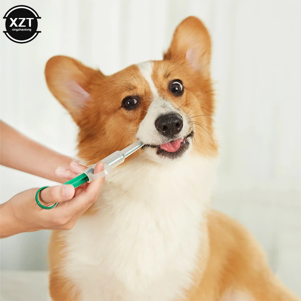 Green plastic pet medicine syringe feeding a Corgi dog, easy pill dispenser for tablets and liquid medication.