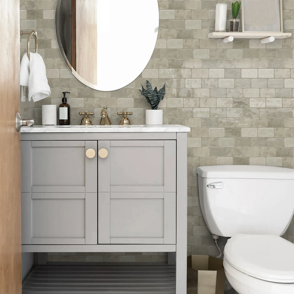 Ceramic tile sticker strip in light gray stone texture on bathroom vanity wall