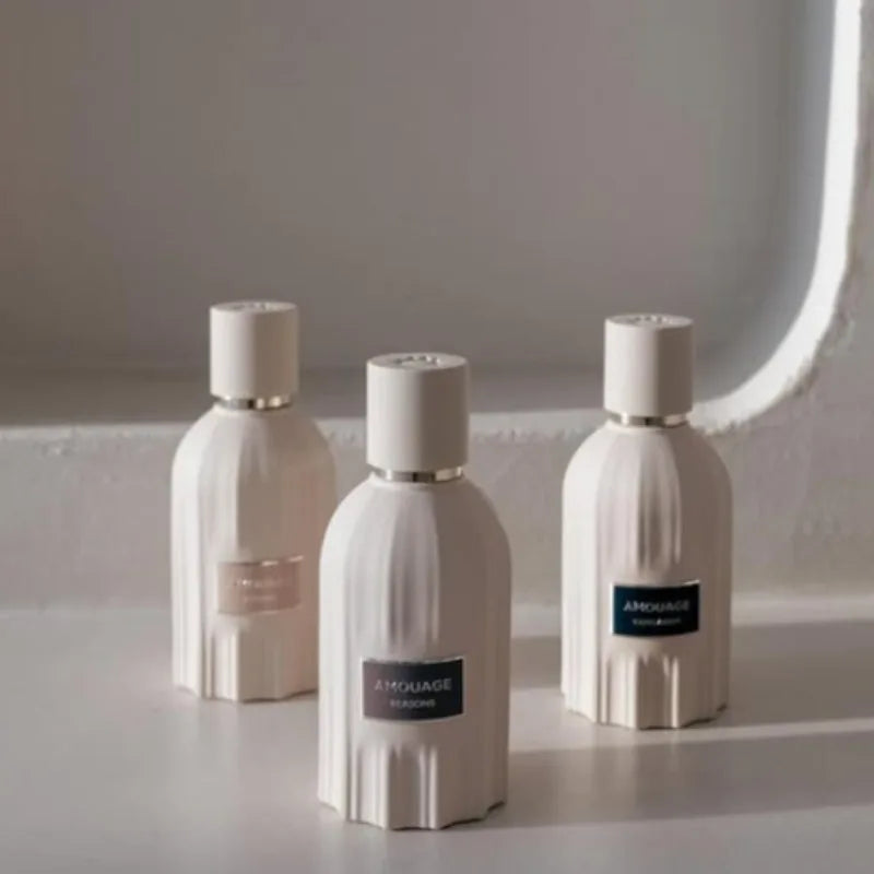 Amouage Lustre 100ml unisex EDP: elegant ribbed white glass bottles featuring woody, oriental, fresh fragrance notes.