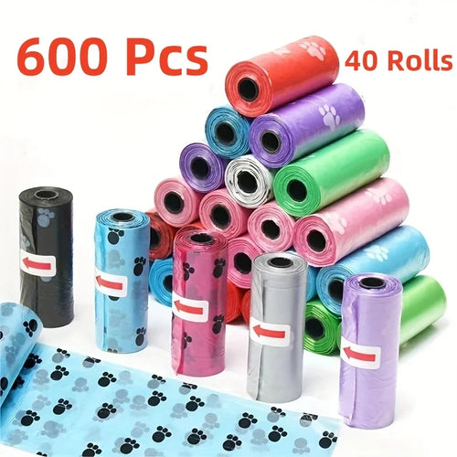 Cartoon paw print dog waste bag rolls in mixed colors, stacked and rolled for storage