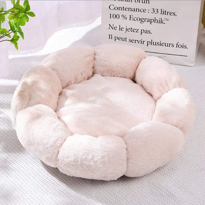 Beige orthopedic plush pet bed with cushioned center and padded side bolsters