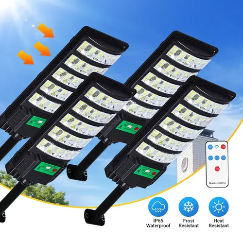 Solar street lights set with four black outdoor fixtures and wide LED panels