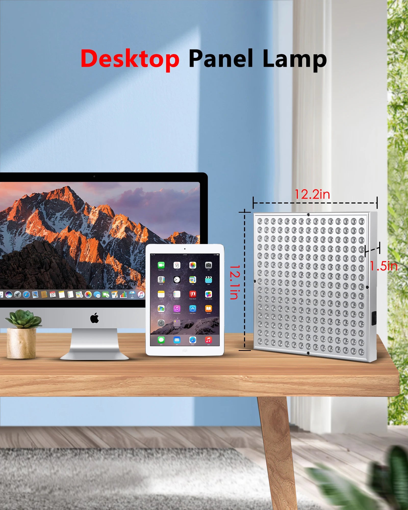 Square silver LED red light therapy panel with 225 bulbs, shown on a desk next to a computer and tablet for scale.