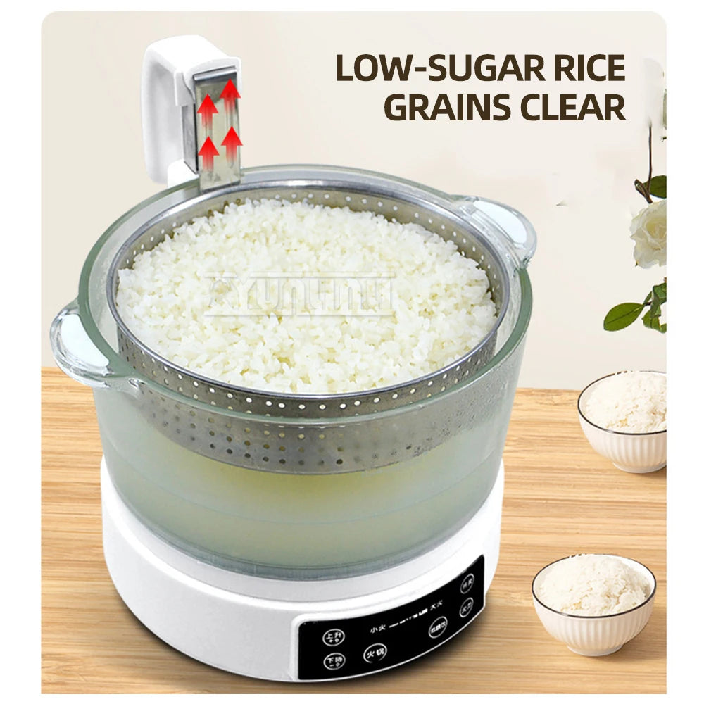 Transparent-lidded electric rice cooker with steaming basket, filled rice visible inside.