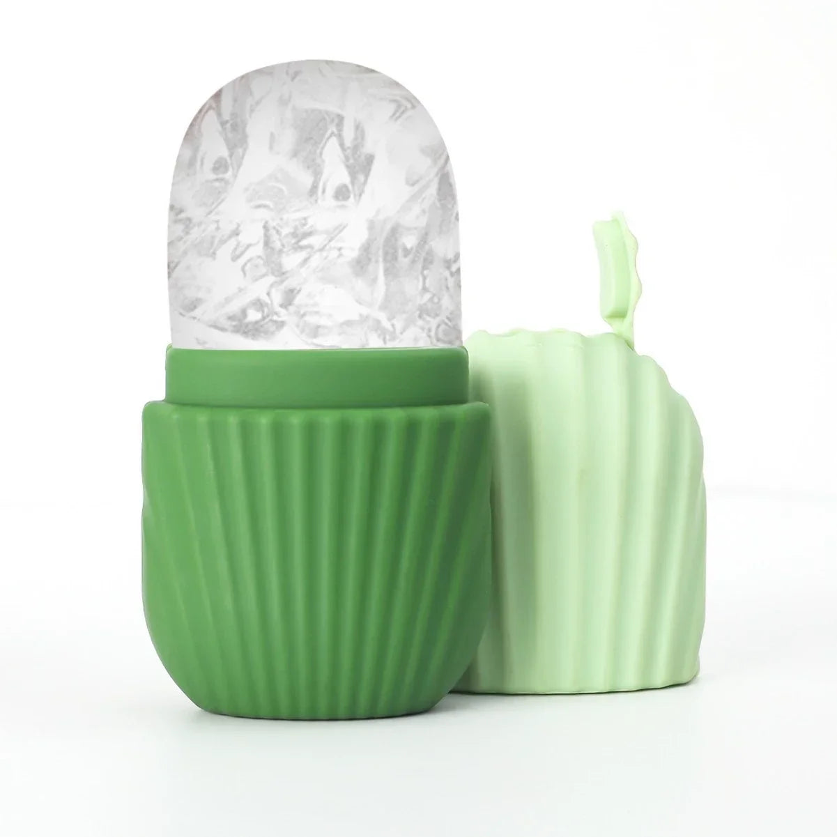 Green silicone ice face roller with a dome-shaped ice head and a separate light green cap, on a white background.
