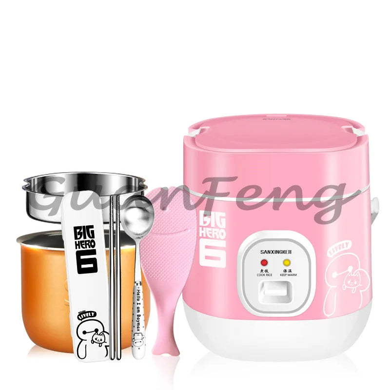 Pink mini rice cooker with inner bowl, measuring spoon, and multi-cook indicator