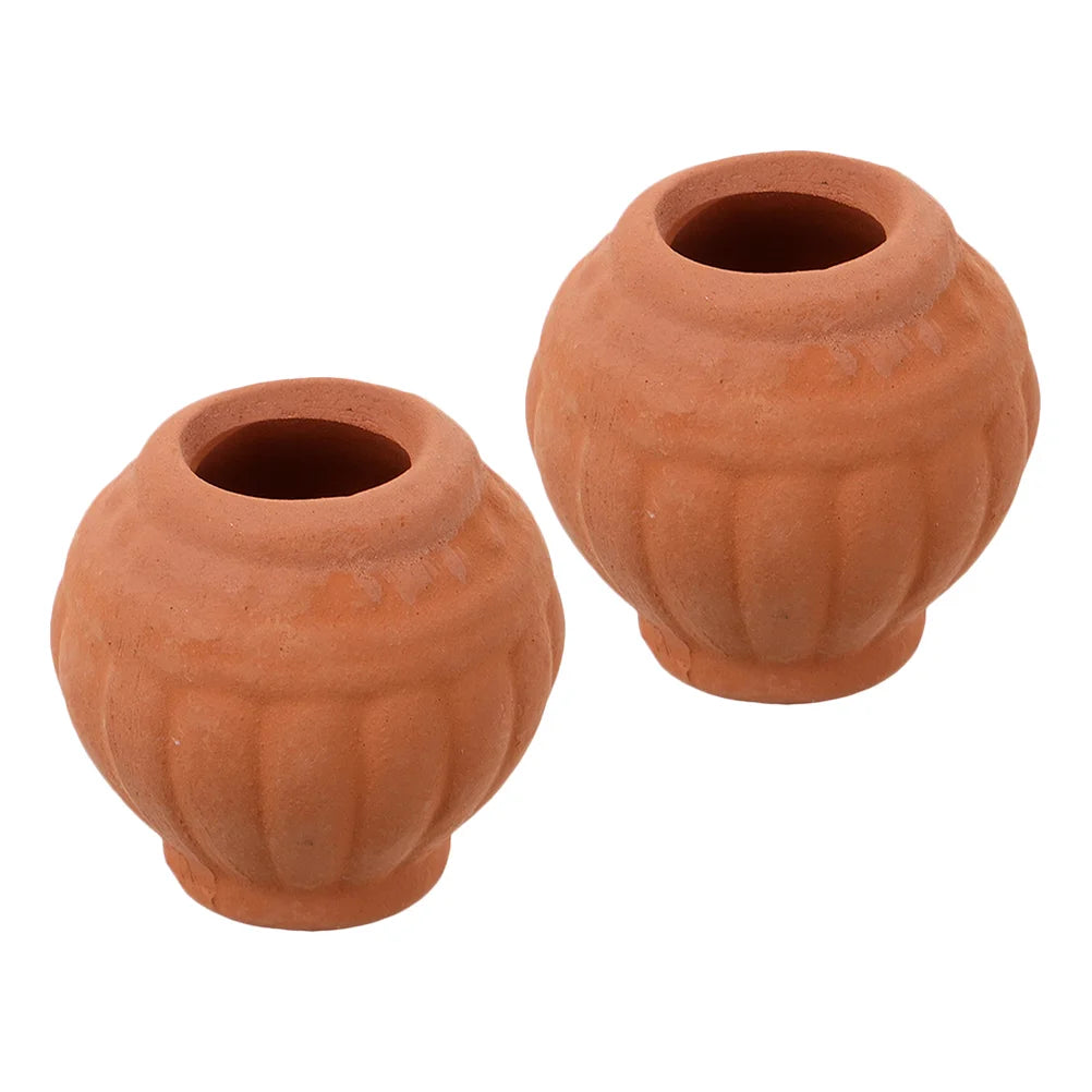Pair of small terracotta clay cactus pots with round shape and drainage openings