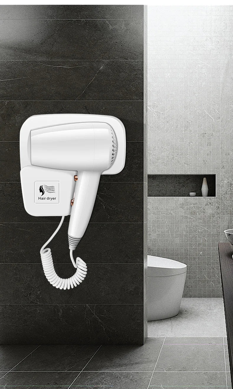 White wall-mounted hair dryer for bathroom with coiled cord, non-perforated hotel design for easy home installation.