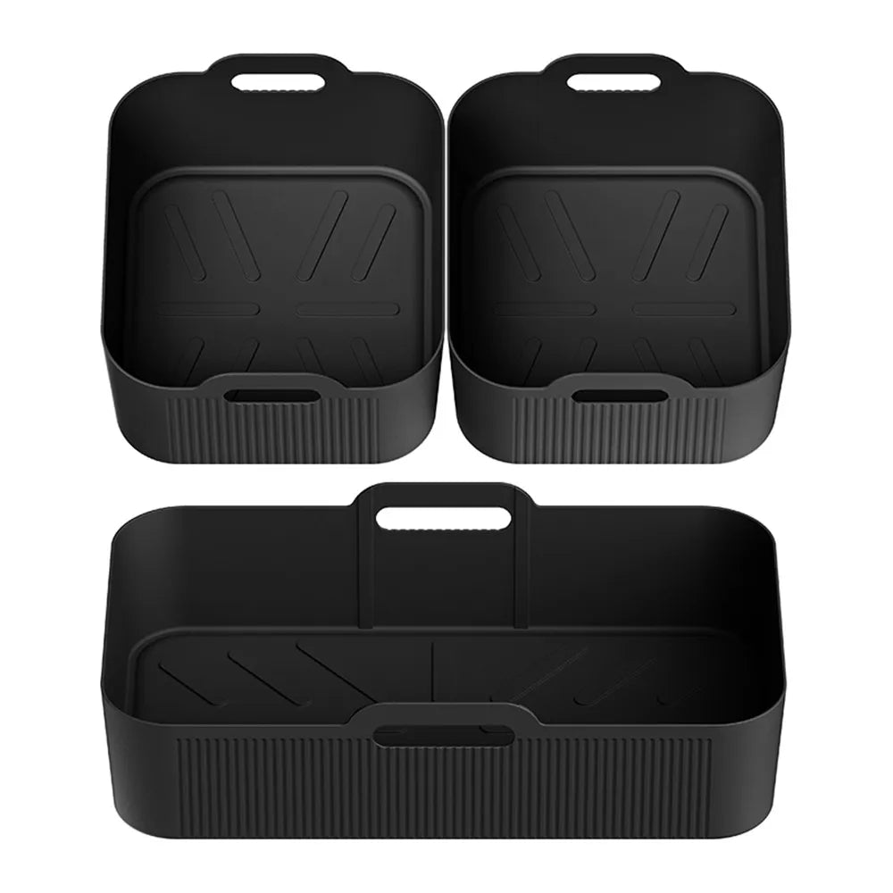 Two black silicone square air fryer liners and one long basket liner, each with carry handle.